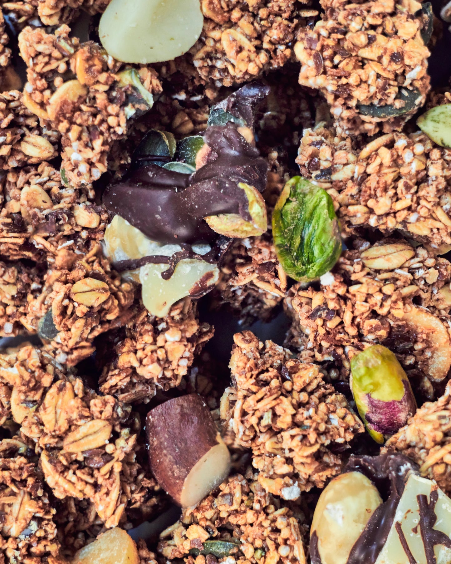 Belgian Dark Chocolate Granola - Naturally Granola close up of chocolate and nuts