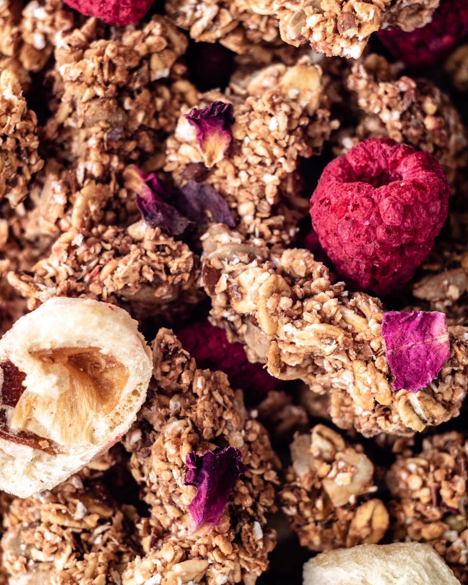 pink-lychee-granola in jar with ingredients in background. Collaboration with 3 star michelin chef gert de mangeleer makro shot